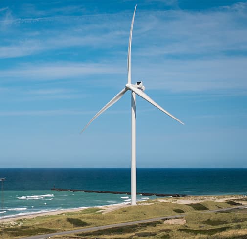 A wind turbine on a coastal ridge